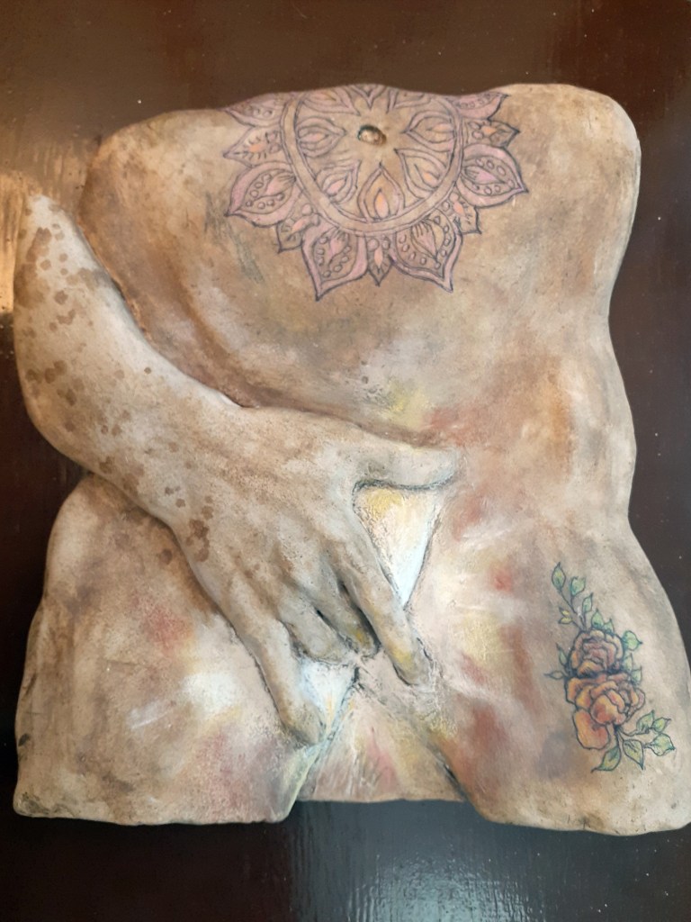 “CONSUELO” 13″ x 14″ x 2″ Terracotta with mixed media. 8 lbs.